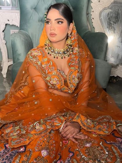 I love the rich embroidery on this outfit and how the kundan jewelry complements it without competing.