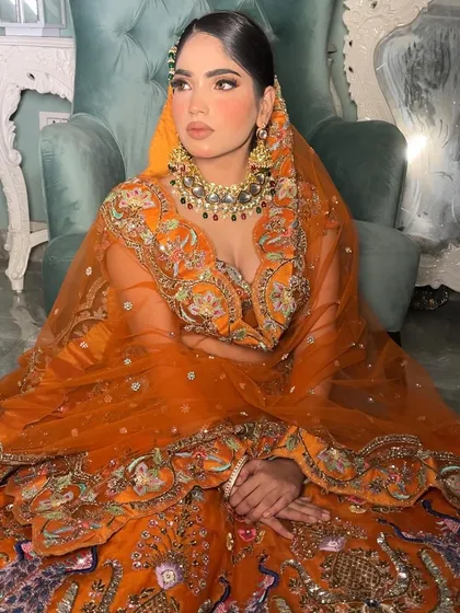 I love the rich embroidery on this outfit and how the kundan jewelry complements it without competing.