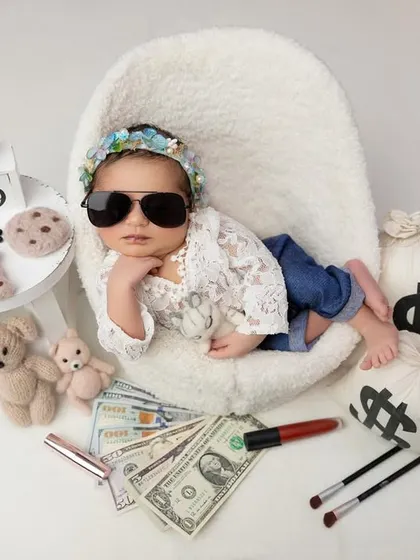 With her sunglasses on, this little girl is ready to take on the world. These playful, stylized sessions are a joy to create and result in unforgettable, fun portraits.