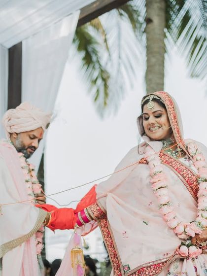 The tying of the knot, a deeply symbolic moment in an Indian wedding. We frame these shots to highlight the connection and the ritual's importance.