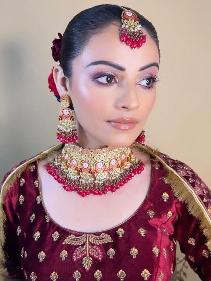 The three-quarter profile highlights the contour and the floral hair accessory. You will learn how to integrate hair accessories seamlessly with your makeup looks.