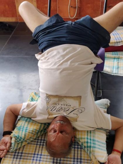 A headstand variation on a chair.