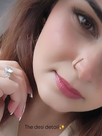 A close-up of the details in a fusion officewear look, including a delicate diamond nose pin that adds a touch of 'desi' flair and individuality.