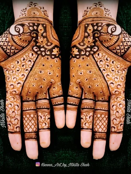 Mehendi is peace (sukoon). This is a classic, full-coverage Indian design with peacock motifs and intricate filler patterns.