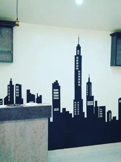 A minimalist city skyline silhouette adds a modern touch to this space. We can customize the skyline to represent any city, creating a sleek and stylish feature wall for homes or offices.