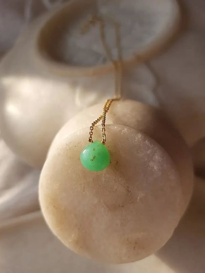 A close-up of the Green Chrysoprase heart drop pendant.