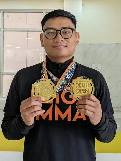 Imlijungba showing off his double gold medals from the SJJIF Delhi Open. He dominated the Masters 1 division in both Gi and No-Gi.