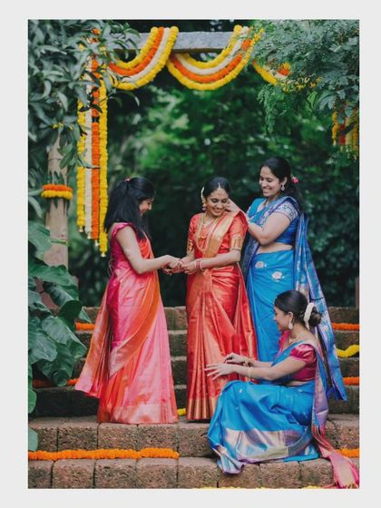 The bride sharing a laugh with her bridesmaids. These candid moments with loved ones are just as important as the main ceremony.