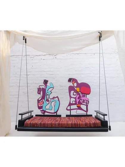 The 'Kaleidochaos' swing is functional art you can interact with. This piece features a teakwood base and modular, abstract backrests made of mild steel that can be reconfigured by the user, turning a simple piece of furniture into a dynamic and personal art experience.
