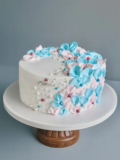 Welcoming a new life is such a special moment, and this baby shower cake was designed to capture that delicate joy. It's a classic Black Forest cake decorated with soft, hand-piped florals in pink and blue. It’s simple, sweet, and perfect for the occasion.