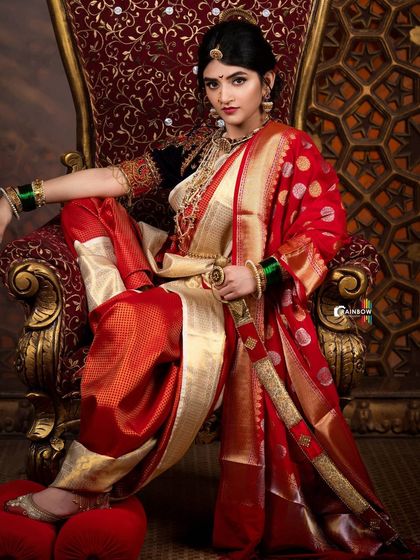 Another take on the red and gold saree look for Sreeleela, capturing a moment of regal poise. These are the kind of shots that build a strong character portfolio.
