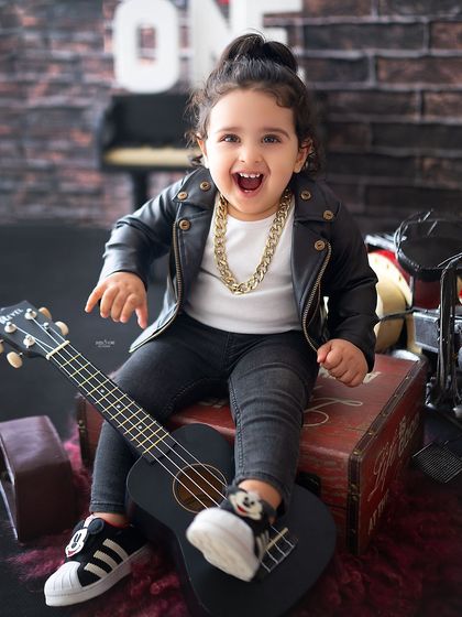 A huge, open-mouthed laugh from this little rockstar. His energy is amazing!