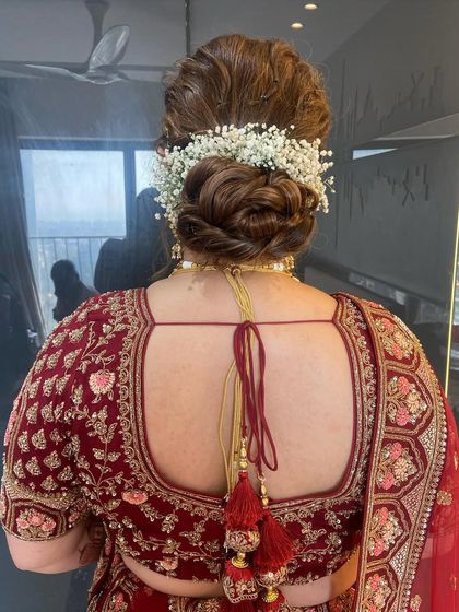 Another view of the baby's breath messy bun, showing its volume and soft texture.