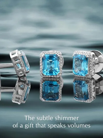 The subtle shimmer of a gift that speaks volumes. These custom cufflinks feature stunning emerald-cut blue topaz stones surrounded by a halo of diamonds. They are a perfect way to add a touch of colour and sophistication to a formal look.