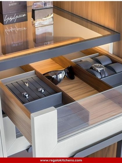 A sleek, glass-topped drawer that displays your watches and accessories while keeping them dust-free. The internal compartments are tailored for specific items like cufflinks and sunglasses.