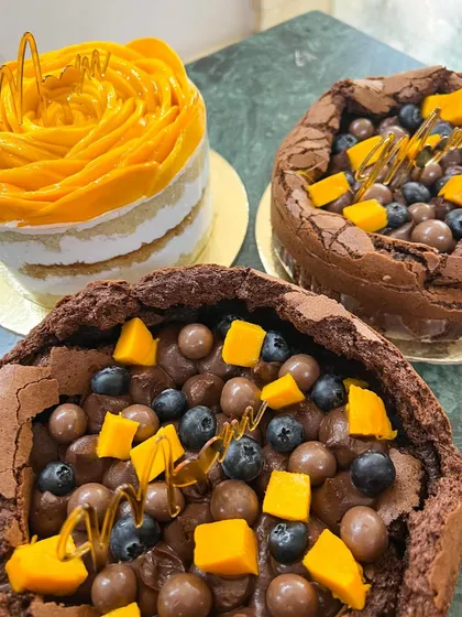 A mango flower cake alongside two of my popular flourless chocolate cakes. It was an insane, wonderful weekend of baking for all the moms out there.