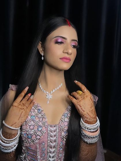 Just married and ready for the reception. This look features a beautiful pink eye makeup and a matching lip.