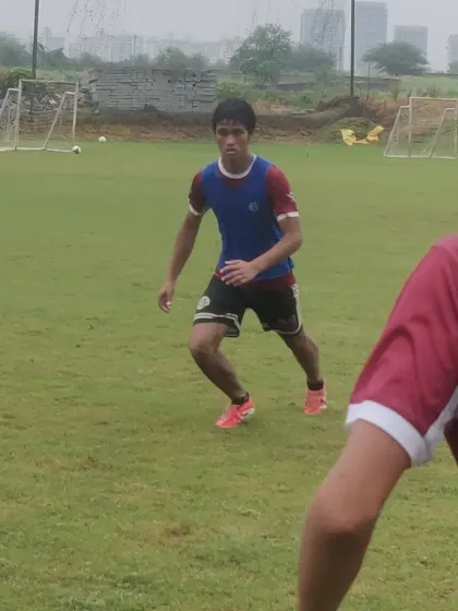 A close-up of a player in a defensive stance during a 1v1 drill, showcasing the focus and intensity required to be a top defender.