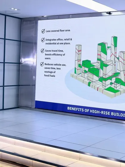 Here I am explaining the core benefits of high-rise buildings during a masterclass. I believe vertical development is crucial for modern cities. It allows us to integrate offices, retail, and homes in one place, which reduces travel time, lowers pollution, and creates space for vital green areas that improve community well-being.