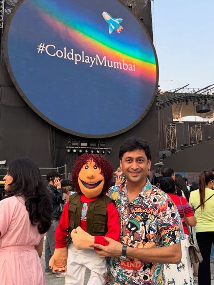 A picture with my puppet in front of the iconic #ColdplayMumbai screen. It was surreal to see our art form featured at such a monumental event.