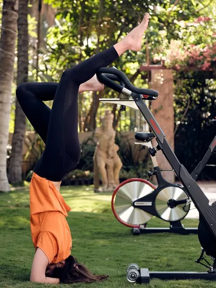 From spin bikes to headstands, our journey has been about finding strength and balance in all forms. This image from our four-year anniversary shoot represents the blend of intensity and mindfulness that we cherish.
