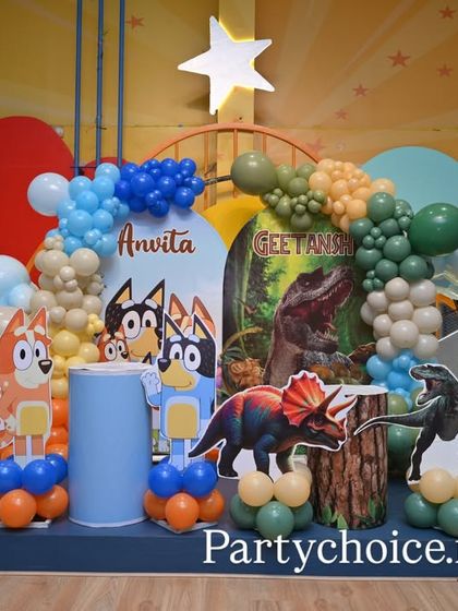 Another angle of the Bluey and Dinosaur stage, highlighting the different character props and balloon arrangements.