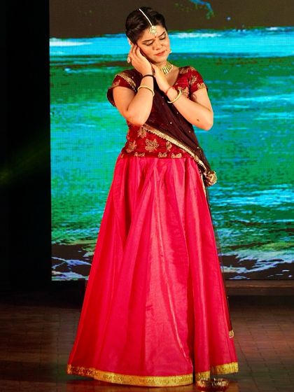 A beautiful moment captured from the production 'Krishna Katha'. Here, I am portraying a gopi, adorned in traditional attire, listening to the tales of Krishna's divine play.