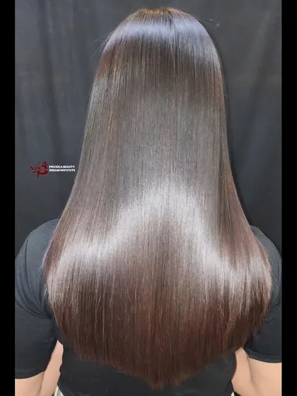 Dreaming of silky, straight hair? This permanent straightening treatment delivers glossy, smooth, and manageable locks, showcasing a dramatic hair transformation.
