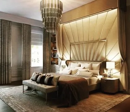 A concept for a truly grand master bedroom. The design features a floor-to-ceiling upholstered headboard that creates a canopy effect, complemented by a cascading chandelier and built-in bookshelves for a look of pure opulence.
