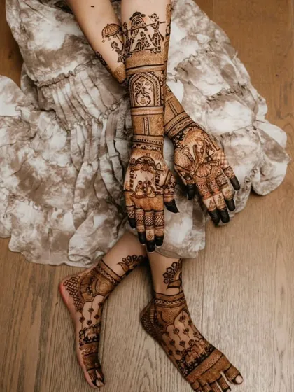 Here you can see a complete bridal mehandi look, with intricate designs covering the full arms and feet. I make sure the patterns are consistent and beautiful from every angle, perfect for your wedding photos.