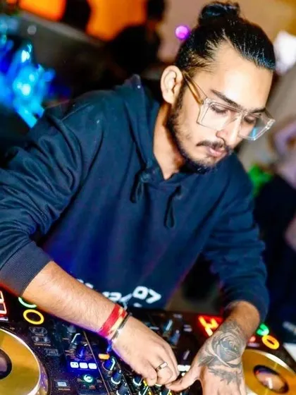 Another angle of me working the decks, ensuring every beat is perfectly timed for the dance floor.