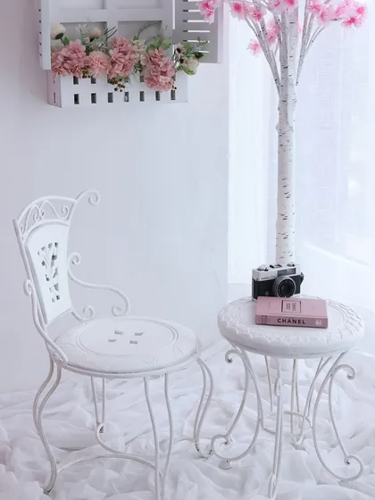 It's all in the details. This little corner of our studio shows some of the smaller props I use to add charm and personality to a setup. The vintage-style chair and table are perfect for classic, elegant portraits.