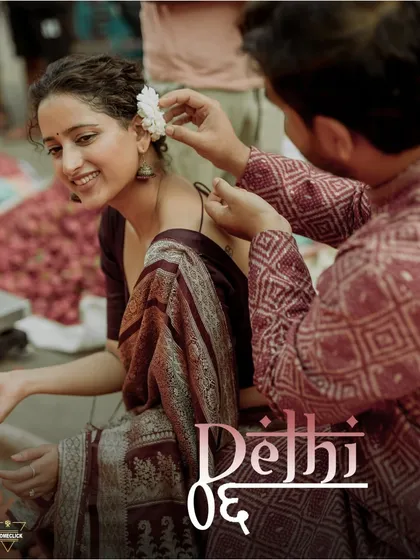 This is what a themed shoot in Old Delhi feels like. I captured this quiet, tender moment as he placed a flower in her hair, surrounded by the authentic hustle of the city. It’s these small, unscripted interactions that truly tell your story, turning a photoshoot into a cherished memory.