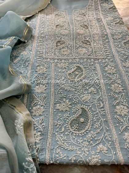 A detail shot of the embroidery, showing the combination of threadwork and sequins.