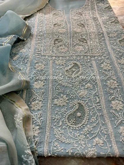 A detail shot of the embroidery, showing the combination of threadwork and sequins.