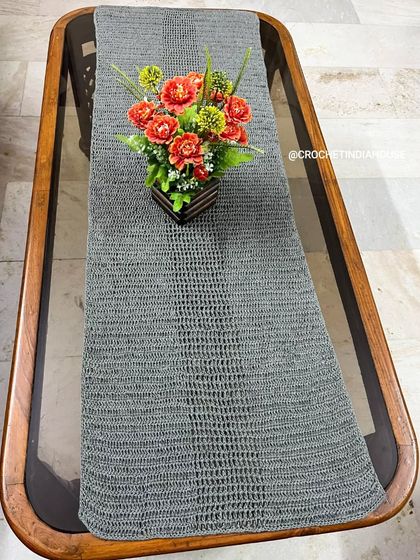 A full-length view of the grey table runner, highlighting the textured stitch pattern. I can make these runners in any length to perfectly fit your table.