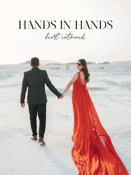 A classic "follow me to" style shot in a stunning white quarry. The bride's vibrant red dress with its long train creates a breathtaking trail of color against the minimalist background.
