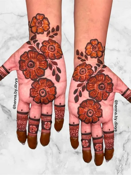 A bold and beautiful floral design for the palms. The large, open flowers create a modern and artistic statement.