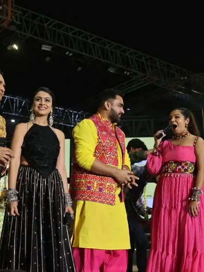 Sharing a laugh on stage with Ojas Rawal and other artists. My ability to build a fun and spontaneous rapport with fellow performers is key to a successful live show.