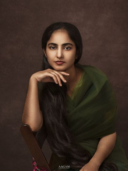 A closer crop that highlights her calm expression and the beautiful, soft light.