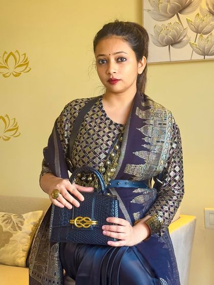 My tribute to the master, Sabyasachi. I created this all-black fusion look by layering a brocade blouse and a Kashmiri shawl over a satin saree, cinched with a belt for a modern silhouette.