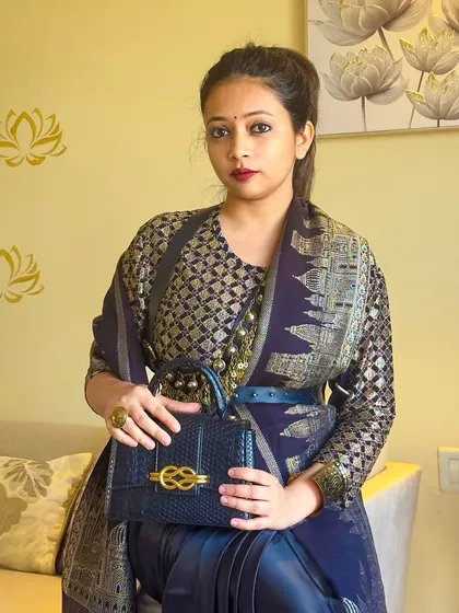 A portrait shot showing the complete look with a bold red lip and a confident expression. This is how you command attention with your style.