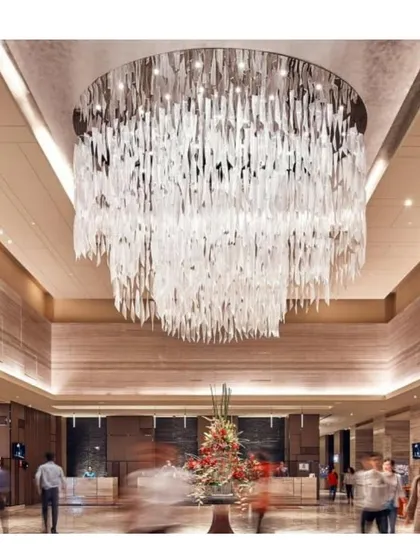For the Sheraton Hotel in Bangalore, we designed this grand lobby centered around a custom chandelier. The fixture acts as a dramatic focal point, demonstrating our expertise in creating luxurious and memorable hospitality interior concepts.