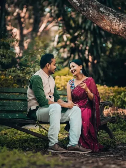 A candid laugh shared on a park bench. We believe the best portraits come from real moments, and we aim to capture the joy you find in each other's company.