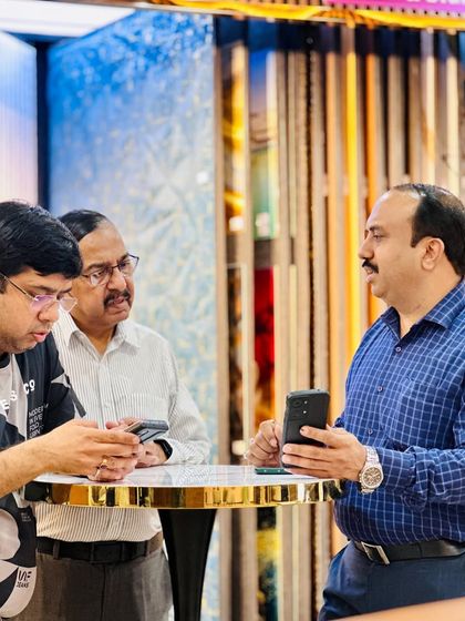 Showing clients our product catalog and explaining the technical details on a smartphone. We use all tools to make the process clear and easy.