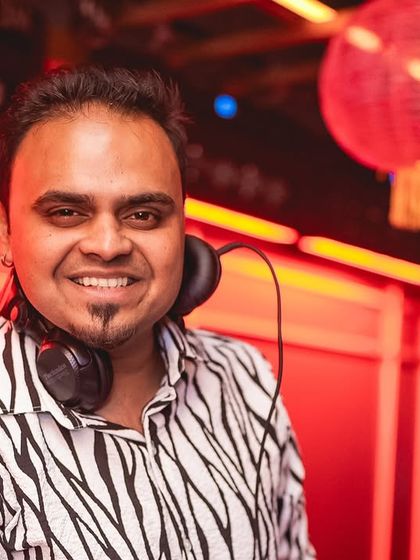 A smiling portrait of me at the decks during a Diwali party.