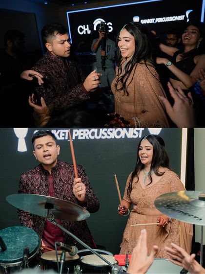 The couple having fun on the drums. We love capturing these unique and interactive moments that make your event special.