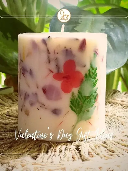 Our Floral Love Pillar Candle is a wonderful Valentine's Day gift. It combines the beauty of real flowers with the warm glow of a candle, making it a truly romantic gesture.