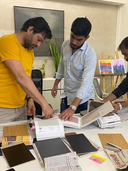 Collaboration is key. Here I am with my team, discussing material options and plans. I believe the best ideas come from teamwork and open discussion.