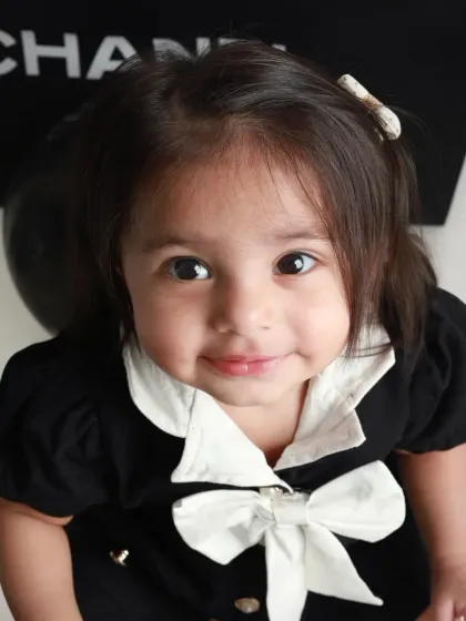 A close-up portrait that captures her sweet smile and beautiful eyes. Sometimes the simplest shots are the most powerful.